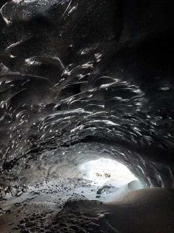 Askur Ice Cave in a Mountain Truck