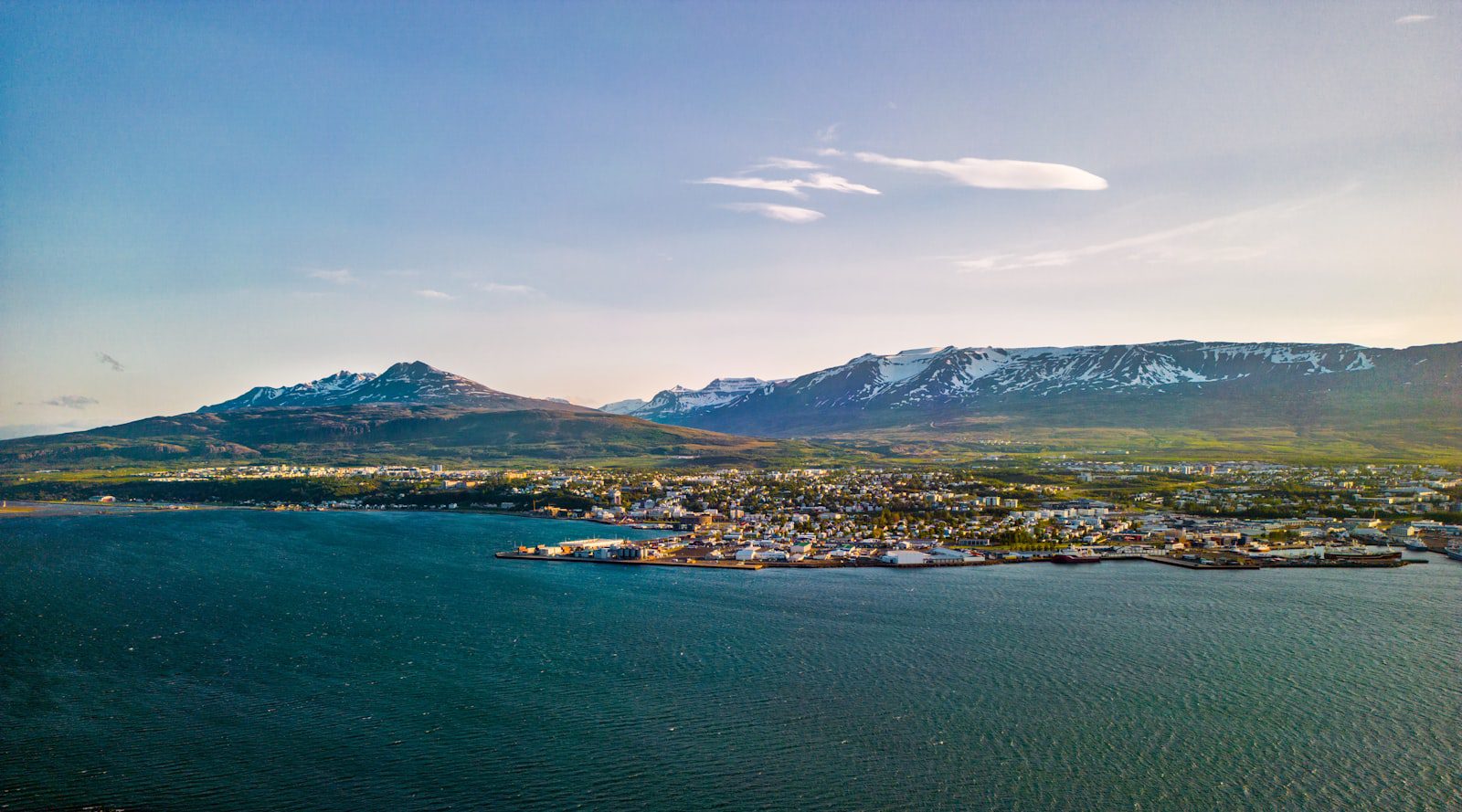 Aerial view of Akureyri Iceland with fjord and snow-capped mountains